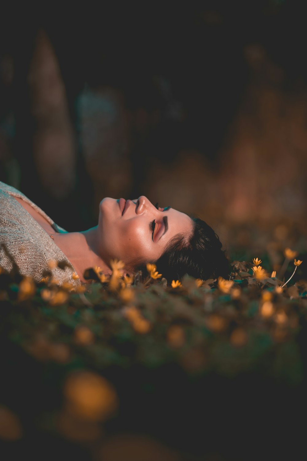 woman lying on grass