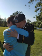 A family reunited with a veteran at a heartfelt community event.