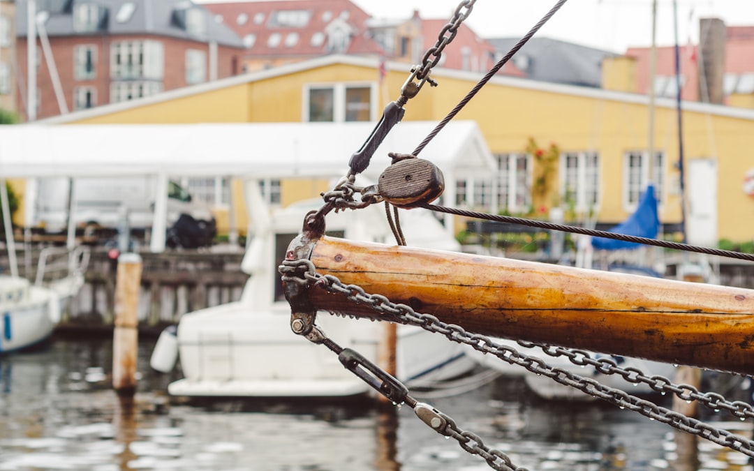 white boat near dock at daytime