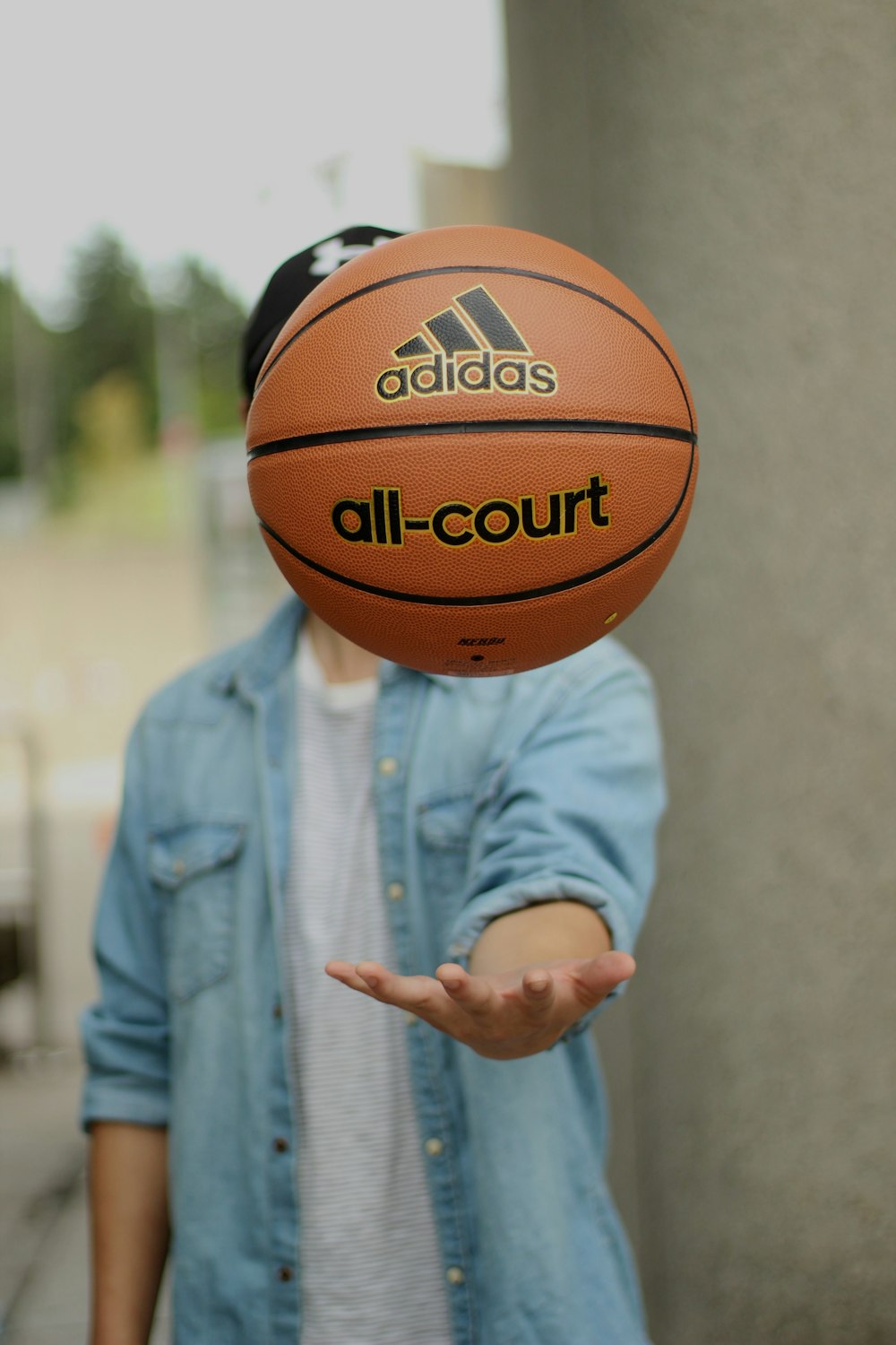 person tossing basketball