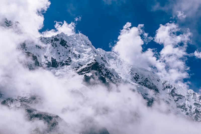 The snow-capped summit of Salkantay wreathed in cloud above the Salkantay trekking route