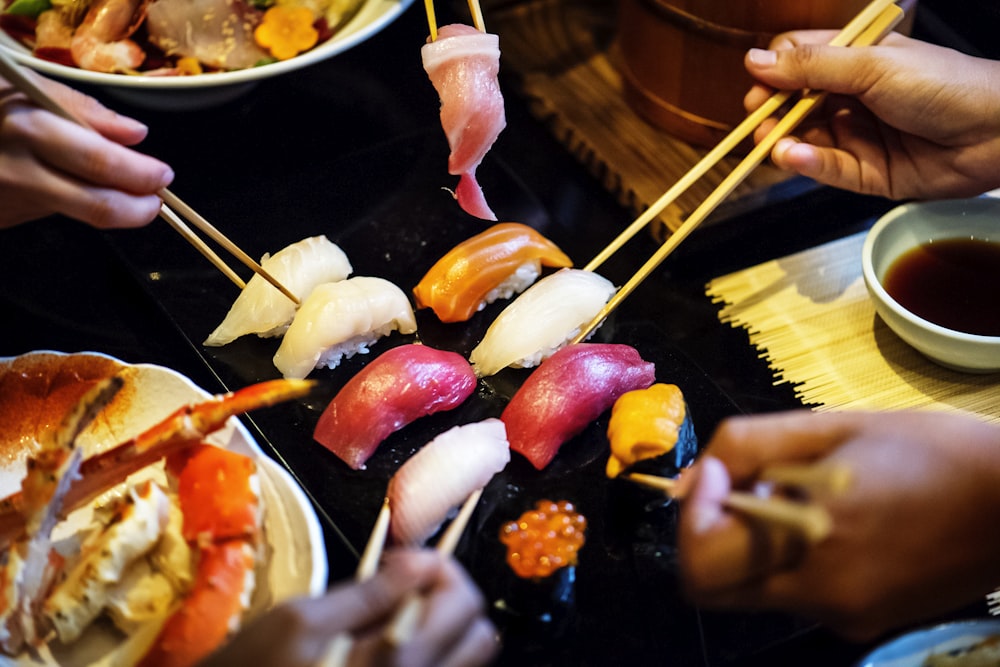 people eating sushi