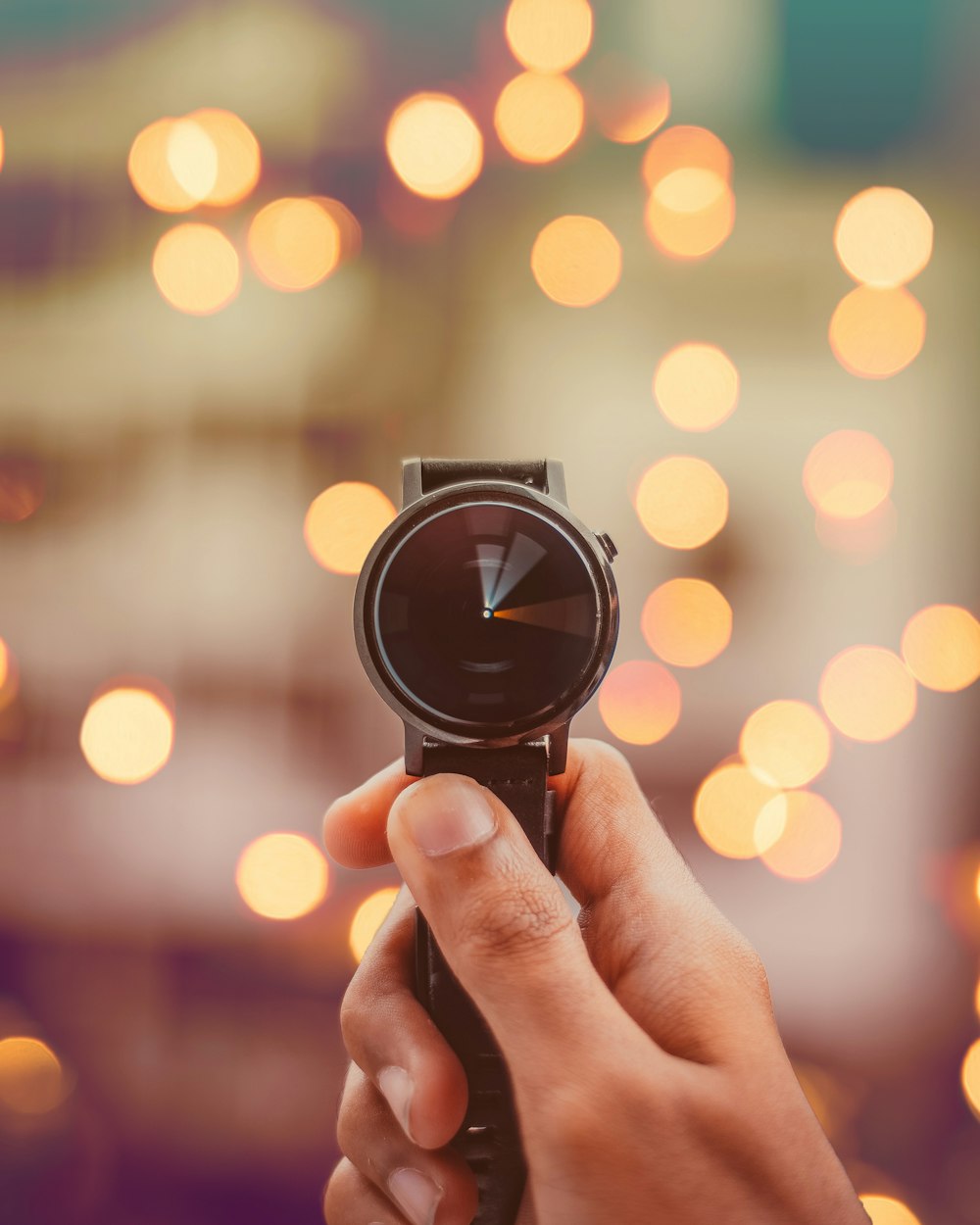 Fotografía bokeh redonda de reloj inteligente de color plateado