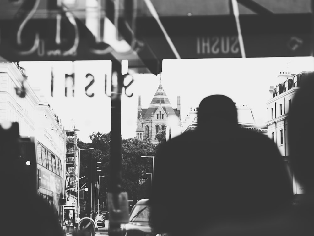 grayscale photography of man inside bus