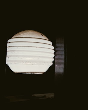 Pearl white glide-inspired décor piece glowing softly against a dark background.