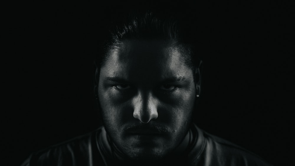 grayscale portrait photo of man