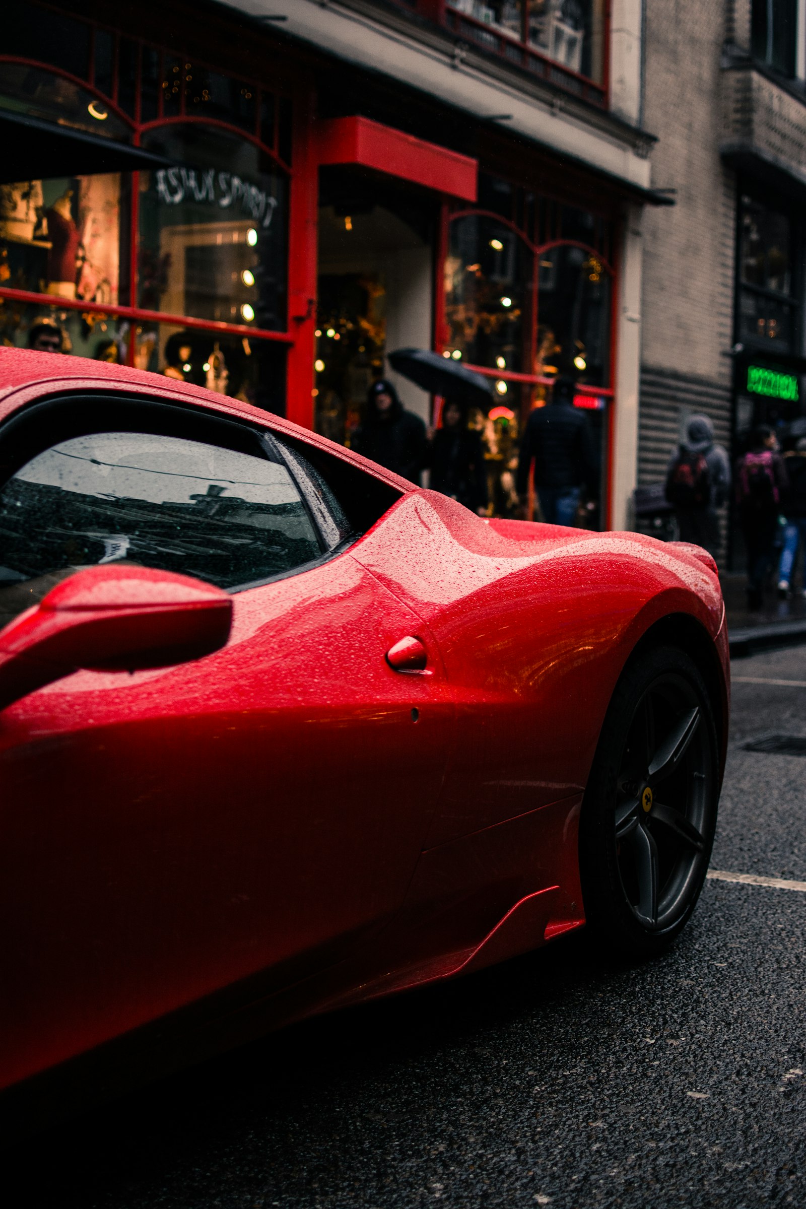 Nikon D5200 + Nikon AF-S DX Nikkor 35mm F1.8G sample photo. Red car beside sidewalk photography