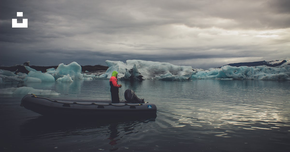 Person riding boat while fishing photo – Free Grey Image on Unsplash