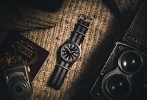 analog watch on brown textile