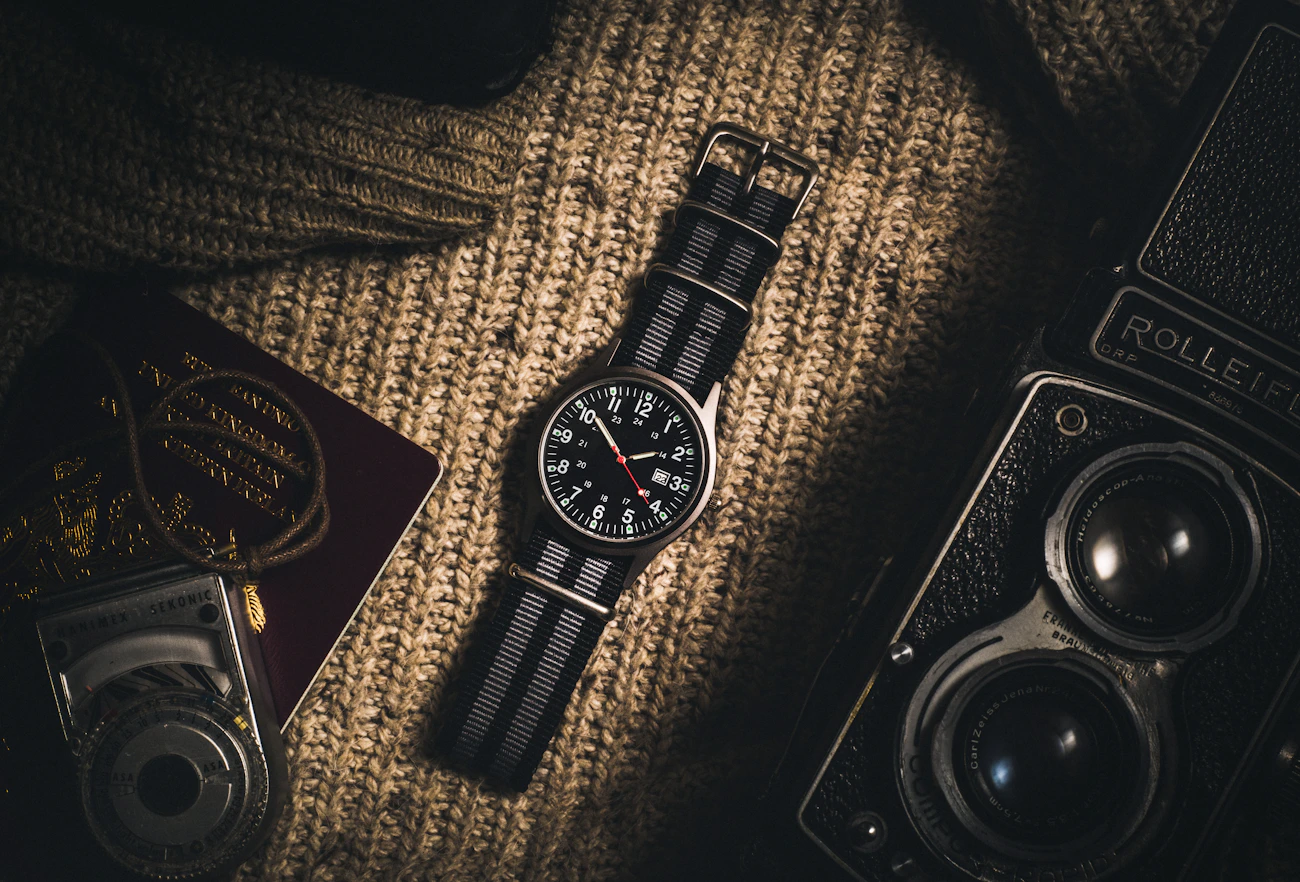 Watch and refined essentials arranged for a daily routine