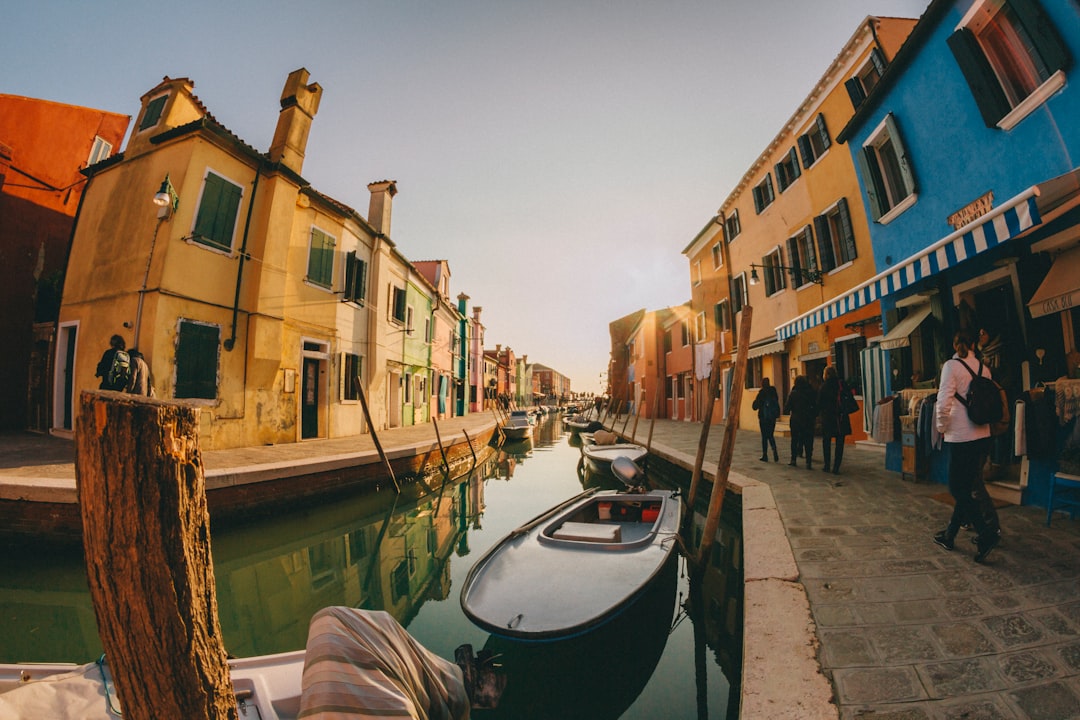 people walking near canal