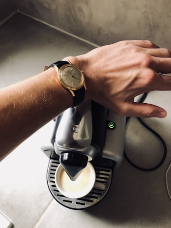 A close-up of a man's wrist wearing a classic watch.