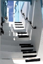 white and black piano keys-themed stairs during daytime