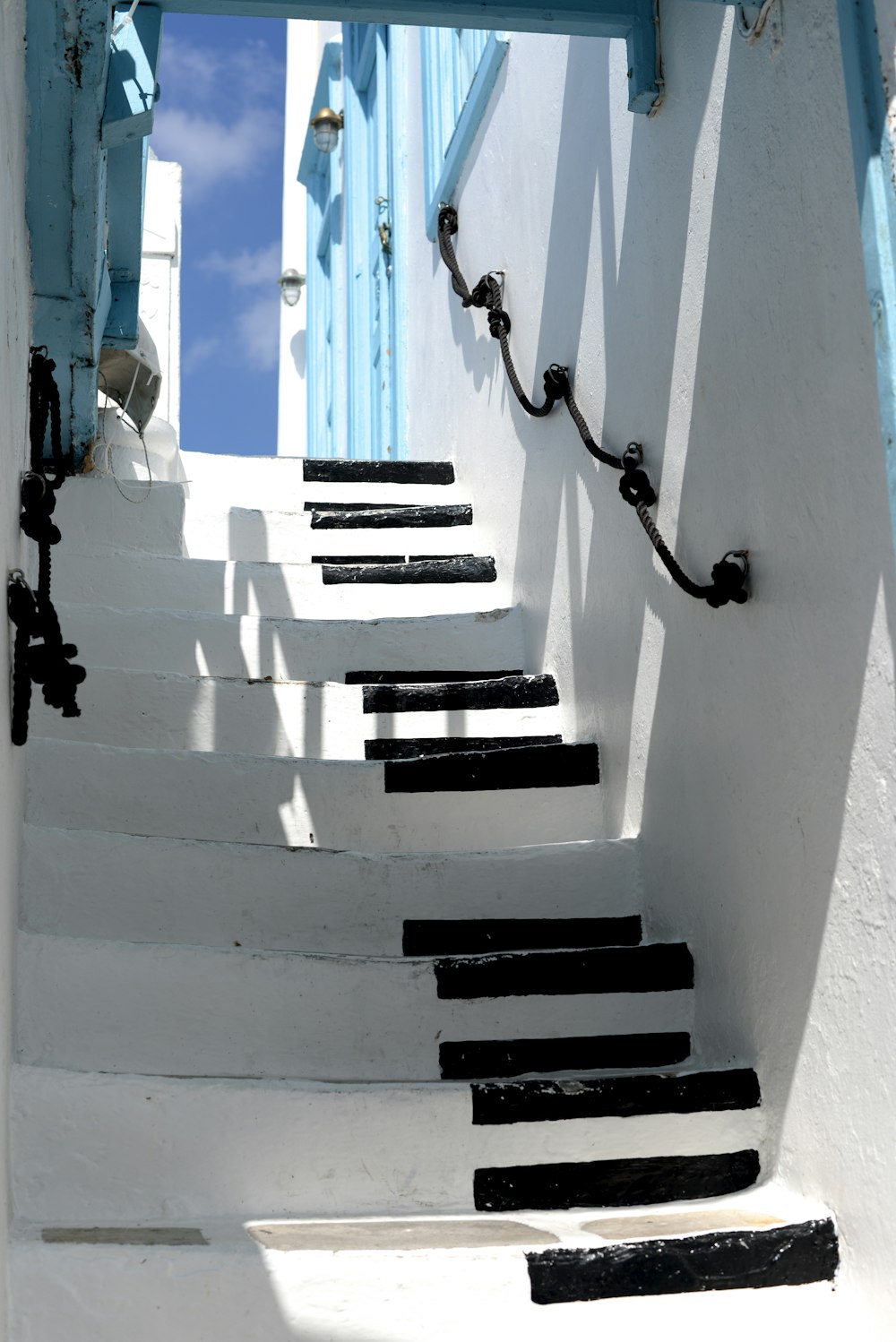 white and black piano keys-themed stairs during daytime