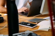 person using silver MacBook