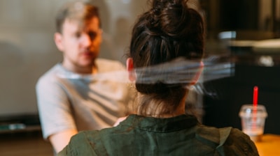 person sitting in a chair in front of a man