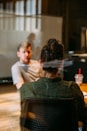 person sitting in a chair in front of a man