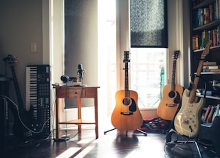 several guitars beside of side table