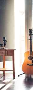several guitars beside of side table