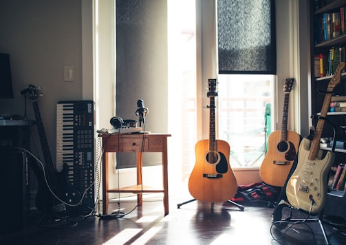 several guitars beside of side table