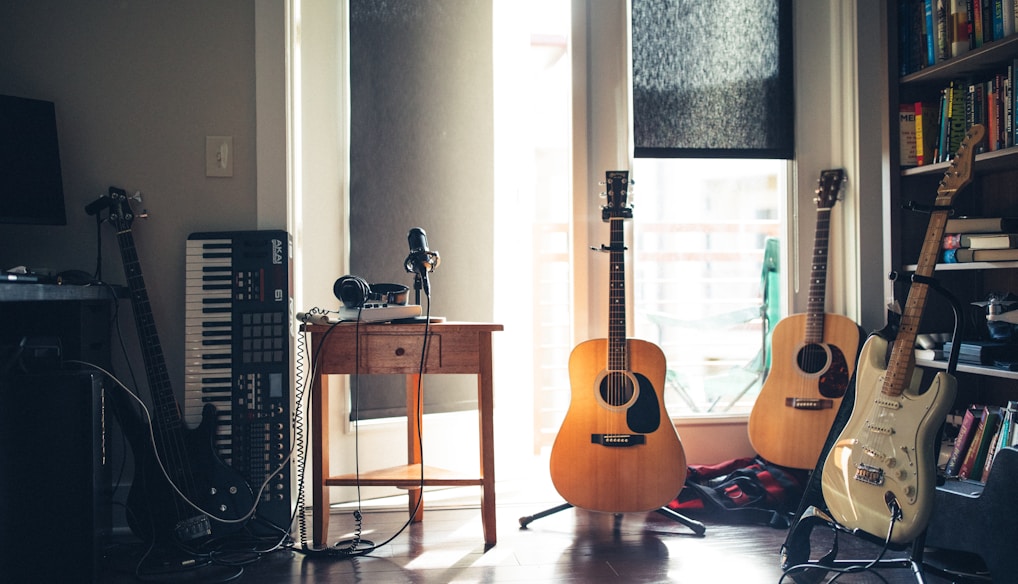 several guitars beside of side table