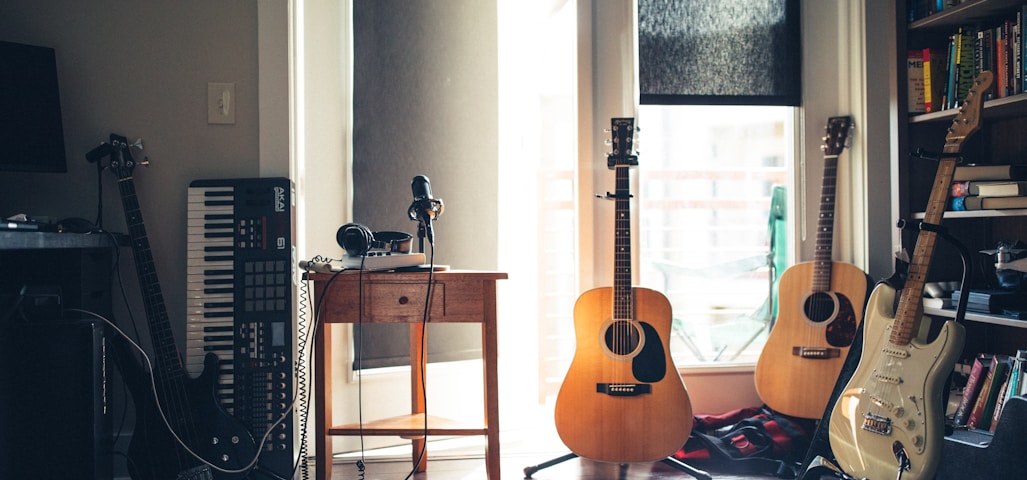 several guitars beside of side table