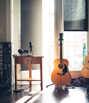 several guitars beside of side table