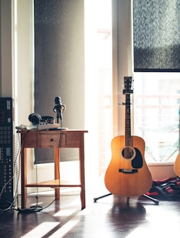 several guitars beside of side table