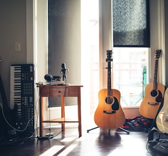 several guitars beside of side table