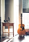 several guitars beside of side table