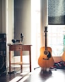 several guitars beside of side table