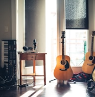 several guitars beside of side table