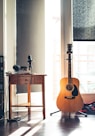 several guitars beside of side table