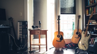 several guitars beside of side table