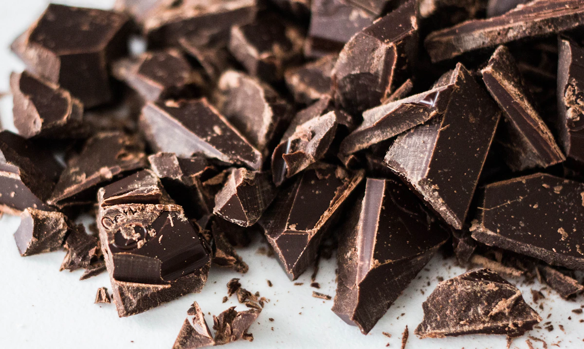 Dark chocolate pieces styled as a refined pantry treat