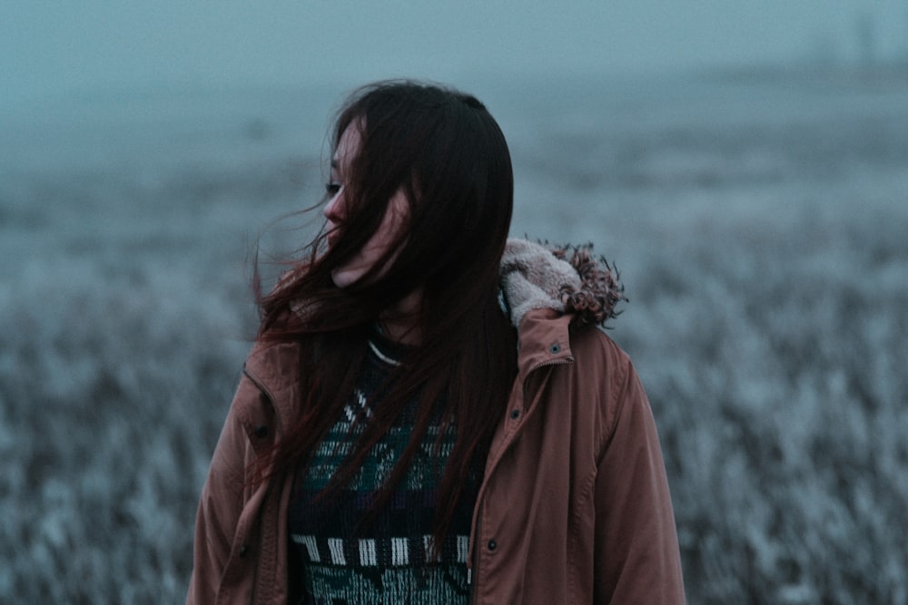 woman standing in grass field