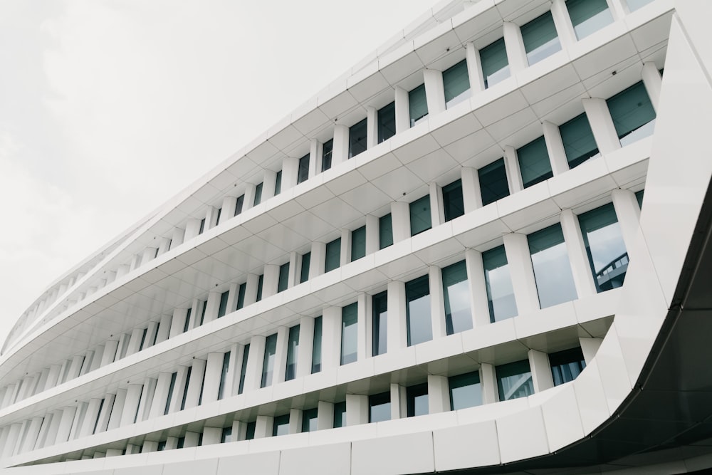 white concrete building under cloudy sky during daytime