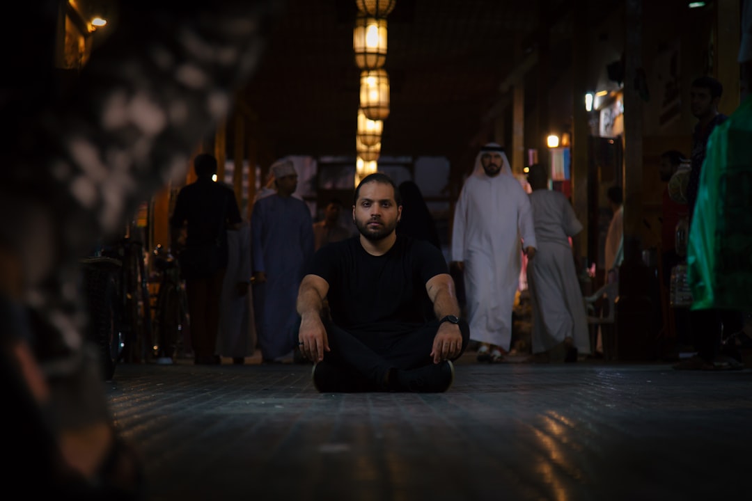 man sitting in the middle of the road, ALone