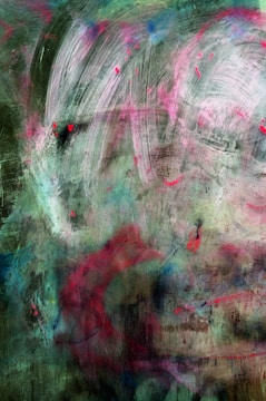 A textured abstract painting featuring a blend of colors. There are sweeping brushstrokes and mixed shades of green, pink, blue, and red. The composition includes overlapping transparent layers and irregular patterns, creating a sense of depth and movement.