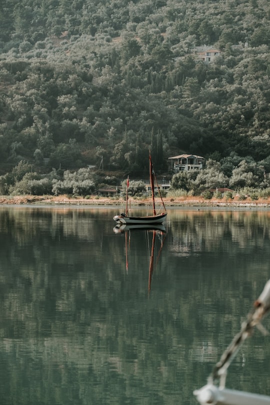 gray boat on body of water in Lefkada Greece