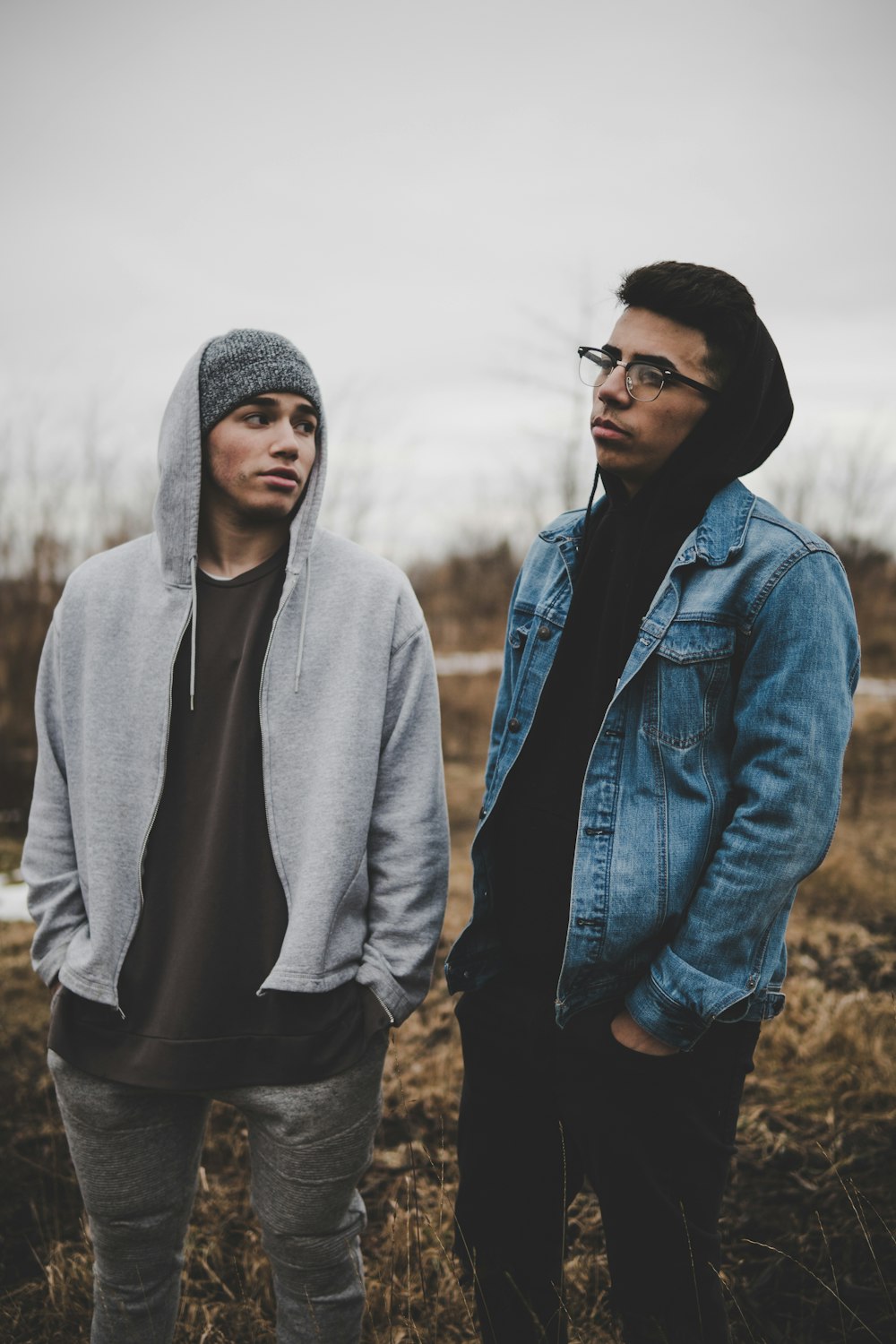 two man standing on grass field