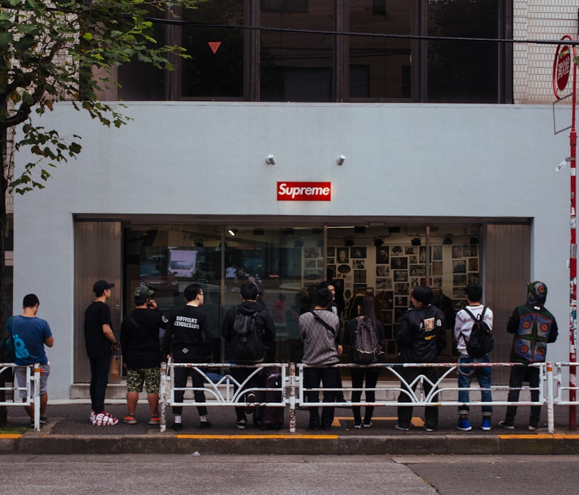 people in line in front of Supreme store