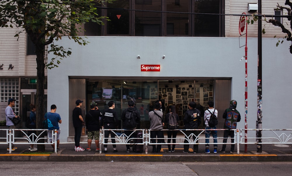 people in line in front of Supreme store