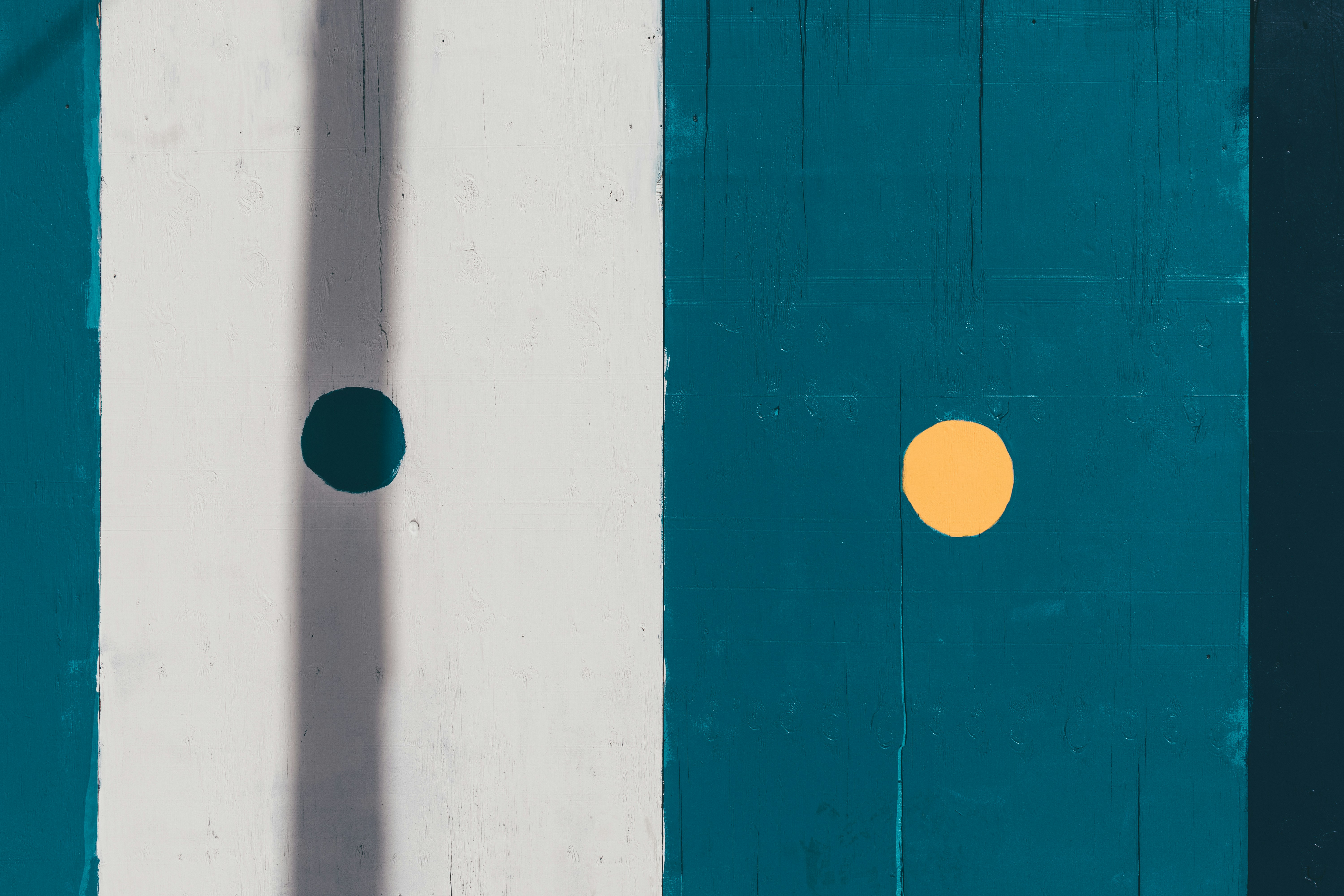 a shadow of a person standing in front of a wall