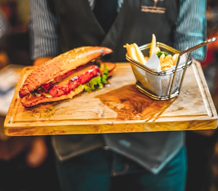 person holding tray of food