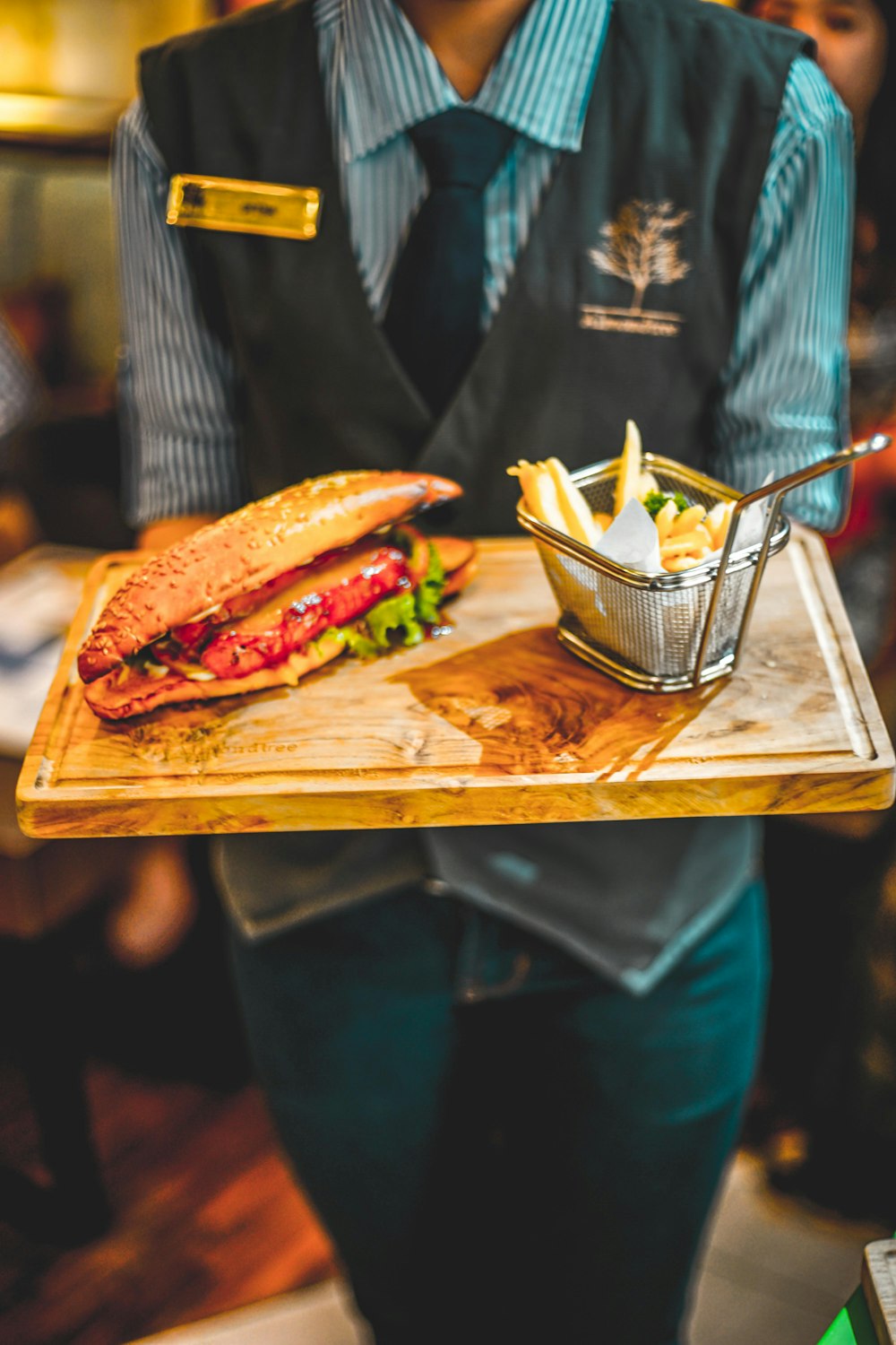 person holding tray of food