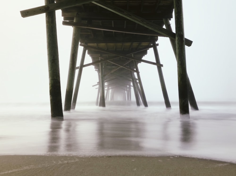 worm's-eye view photography of brown wooden dock