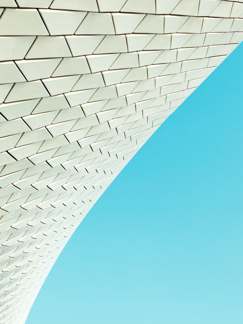 white and blue concrete building under blue sky during daytime