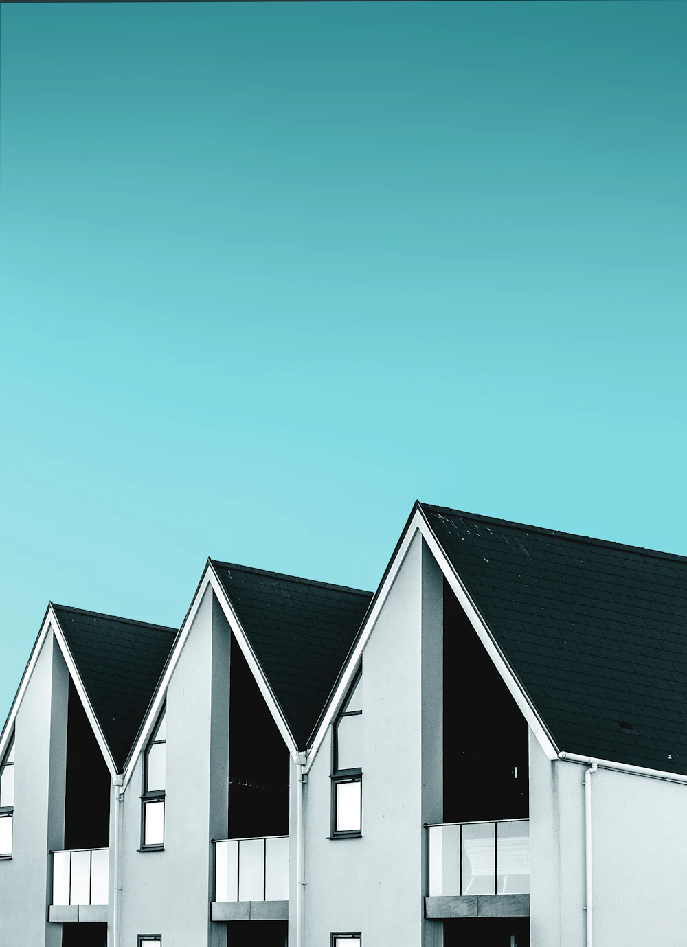 A pair of matching single-storey homes sharing a boundary wall
