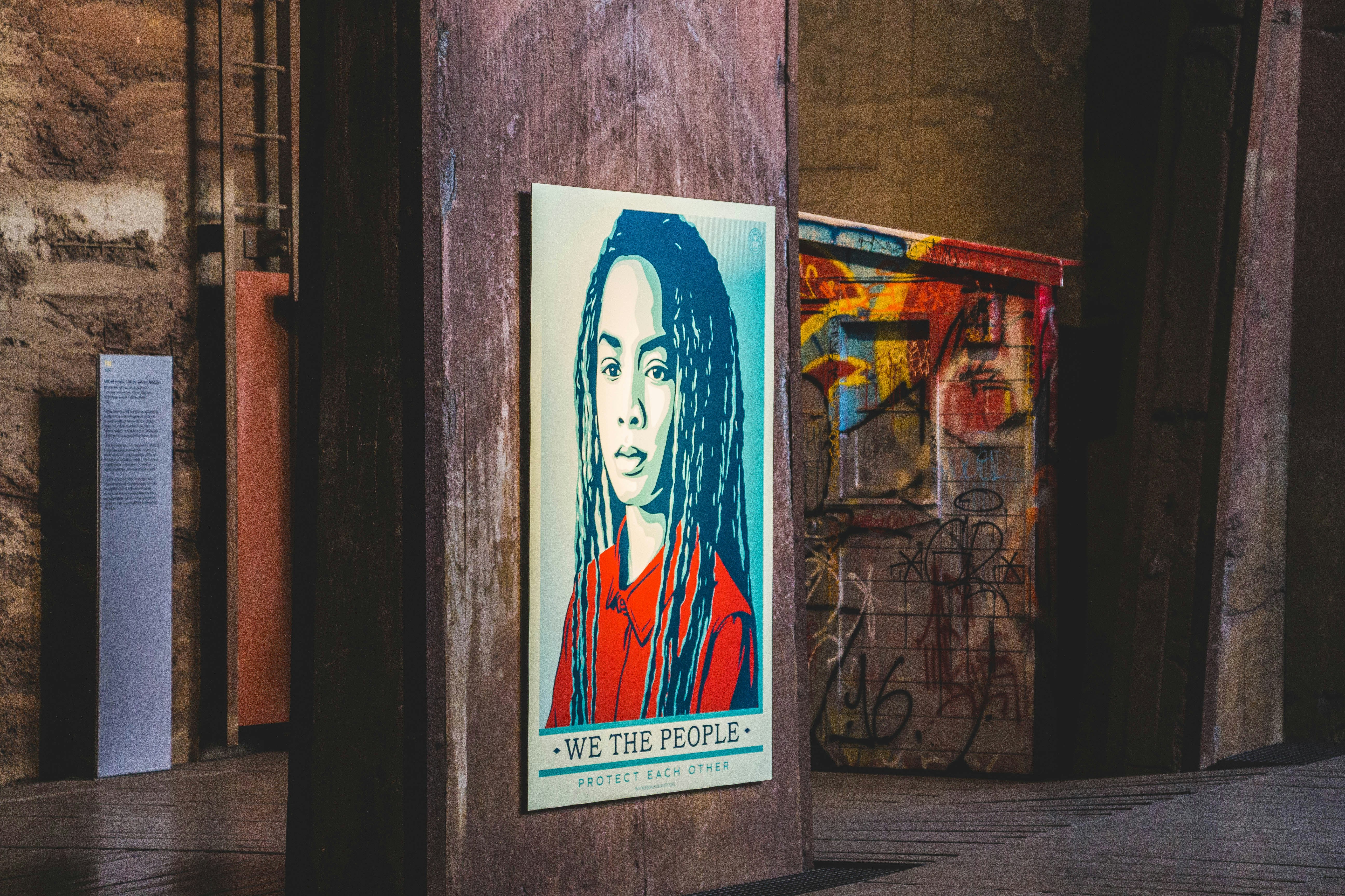 person's portrait poster on wall